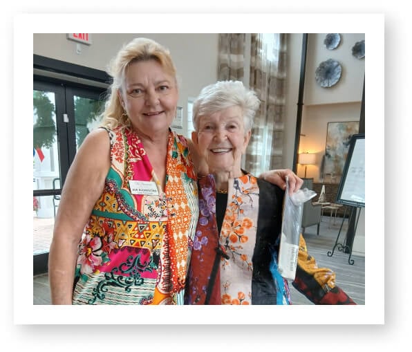 Elderly Resident and Family Member at Community Event in Assisted Living