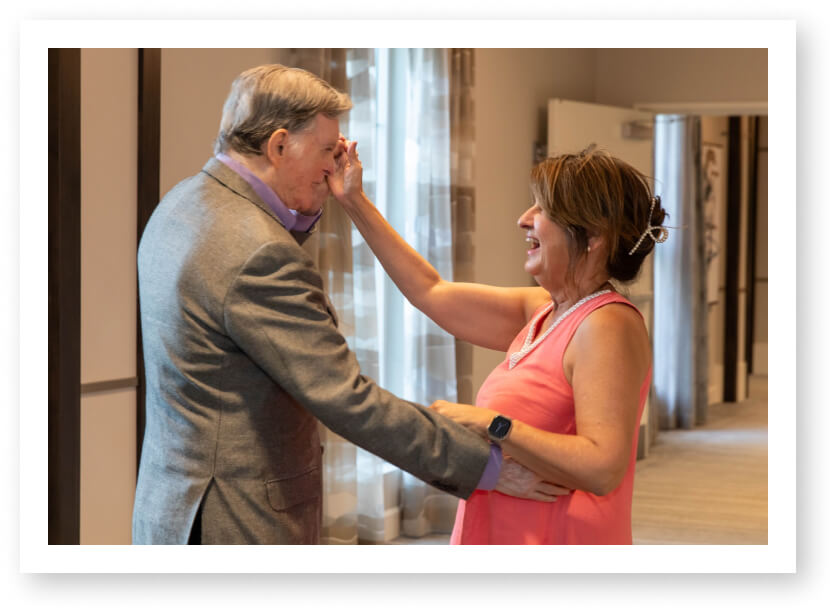 Elderly Couple Enjoying Dance Together at Social Event in Assisted Living